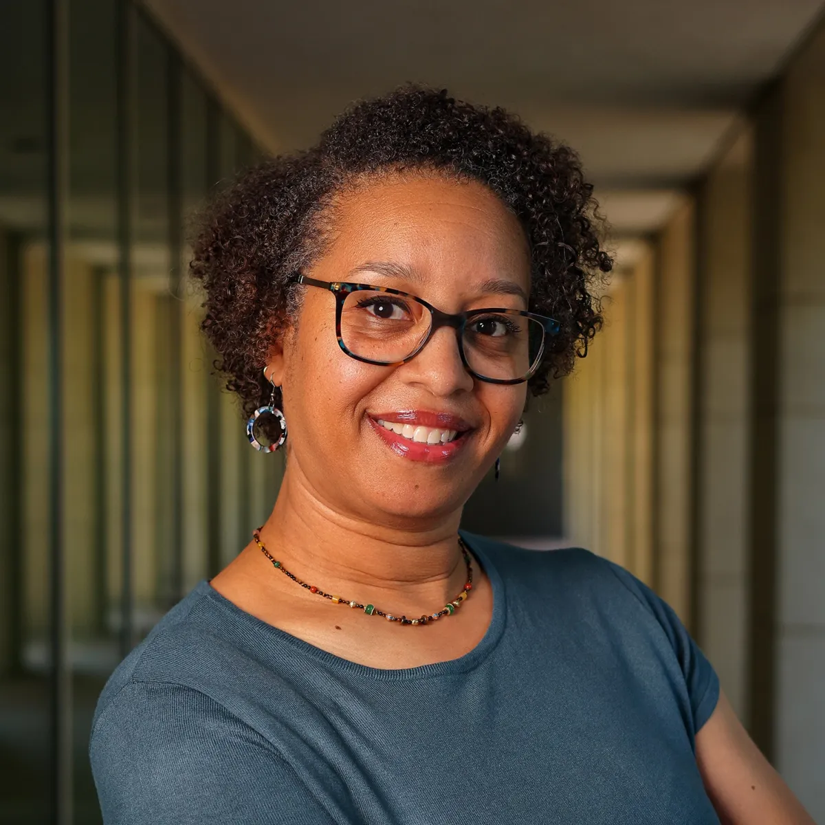 Niasha Hicks headshot with her arms crossed